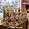 Woodland Forest 24 Ornament Christmas Advent Calendar with various miniature resin forest animal figures on a wooden table.