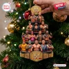 Hand holding a WWE Legends Christmas Ornament 2026 shaped like a multi-level wrestling ring with figures.