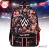 Front view of a black backpack featuring a collage of professional wrestlers and a custom name pocket.