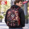 Rear view of a man wearing a black and red custom wrestling backpack featuring multiple portraits.
