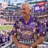 Man wearing a purple Minnesota Vikings Hawaiian shirt at a football stadium.
