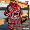 Front view of Ohio State Buckeyes Hawaiian shirt hanging on wooden railing.