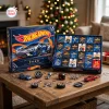 Front view of the 24 Days of Racing Advent Calendar 2026 box with open compartments and keychain items displayed on a table.