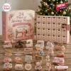 Front view of the 24 Days of Sewing Magic Advent Calendar box and twenty-one miniature sewing items.