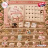 Front view of 24 Days of Sewing Magic Advent Calendar with miniature sewing machine and accessories.