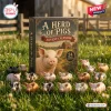 Front view of A Herd of Pigs Pig Animal Advent Calendar box surrounded by small pig figurines on grass.