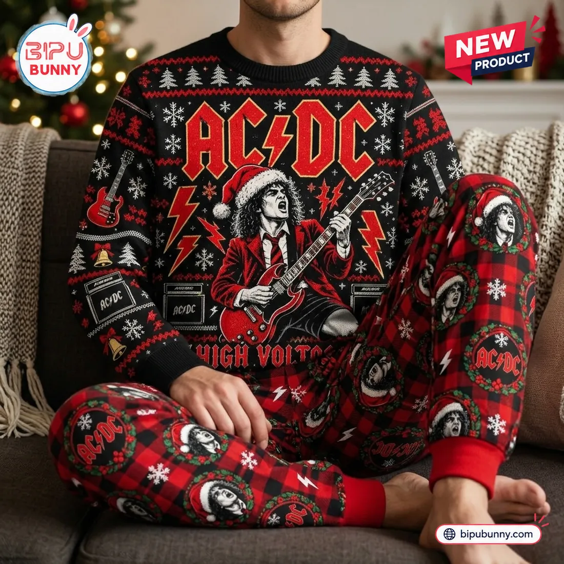 Person relaxing on a living room couch wearing the AC/DC High Voltage Christmas sweater and jogger set