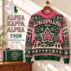 Front view of an Alpha Kappa Alpha 1908 Ugly Christmas Sweater featuring pink and green holiday motifs.