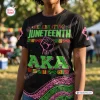 Front view of an Alpha Kappa AKA Juneteenth Black History Month shirt featuring green lettering and a raised fist graphic.
