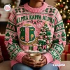Front view of an Alpha Kappa Alpha Pink Ugly Christmas Sweater featuring a crest and Christmas tree design.