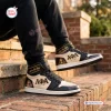 Lifestyle view of Alpha Phi Alpha Retro High Top Air Jordan 1 Sneakers worn on brick steps.