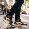 Side view of Alpha Phi Alpha Retro High Top Air Jordan 1 Sneakers worn on a city street.