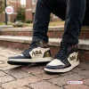 Lifestyle view of Alpha Phi Alpha Retro High Top Air Jordan 1 Sneakers worn with dark jeans.