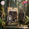 Front view of Aragorn The Lord Of The Rings 25th Anniversary Figure standing beside its decorated box in a forest.