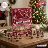 Front view of an Arizona Cardinals NFL Advent Calendar with mini figurines displayed on a wooden table.