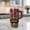 Front view of an Atlanta Falcons Rise Up 60th Anniversary Tumbler with handle on a counter.