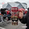 Handheld front view of an Atlanta Falcons Rise Up 60th Anniversary Tumbler at a stadium tailgate.
