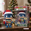 Front view of the Batman Holiday Lights Edition Vinyl Figure standing beside its decorated packaging.