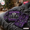 Front view of the Black Sabbath Christmas ugly sweater and pants set displayed on a bed.