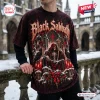Front view of a person wearing a Black Sabbath Gothic Christmas T-shirt featuring a skeletal figure and ravens.