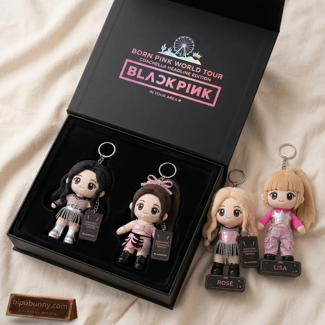 Open BLACKPINK Born Pink Coachella Headline Edition hinged collector box with Ferris wheel crest and velvet tray holding Jisoo and Jennie plush dolls