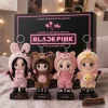 Front view of four plush animal mascot keychains with lightsticks and name stands.