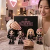 Close-up of a person holding the BLACKPINK Kill This Love Iconic Warrior Edition Plush Keychain Set in a room.
