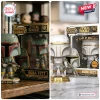 Front view of two Boba Fett vinyl figures in their boxes with 50th anniversary branding.