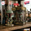 Front view of Boba Fett Star Wars 50th Anniversary vinyl figure standing beside its packaging box.