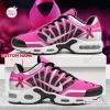 Side view of Breast Cancer Awareness Ribbon Air Max Plus Sneakers featuring pink and white design with ribbon motifs.