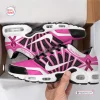 Side view of Breast Cancer Awareness Ribbon Air Max Plus sneakers in pink and white inside a box.