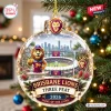 Front view of Brisbane Lions AFL 2026 Three-Peat glass ornament hanging on a tree.