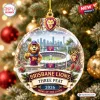 Front view of Brisbane Lions AFL 2026 Three-Peat Glass Ornament hanging on a Christmas tree.