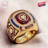 Closeup of Brisbane Lions AFL Champions 2024-2026 Three-Peat Ring with red center stone.