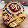 Closeup of Brisbane Lions AFL Champions 2024-2026 Three-Peat Ring with red stone and lion emblem.