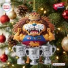 Front view of Brisbane Lions AFL Threepeat Trophy Acrylic Ornament hanging on a Christmas tree.