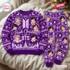 Front view of a purple Christmas sweater and jogger pants set featuring portraits and winter motifs.