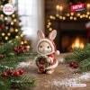 Front view of Bunny Christmas 2026 Advent Calendar figurine wearing a red Santa suit holding a wreath.