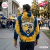 Back view of a person wearing a blue and yellow tie-dye California Golden Bears college hoodie outdoors.