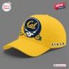 Front three-quarter view of a yellow baseball cap with a blue skull graphic and California Golden Bears branding.