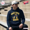 Man wearing a California Golden Bears Grateful Dead Pullover Hoodie while sitting on stadium bleachers.
