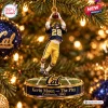 Closeup of California Golden Bears Kevin Moen Ornament hanging on a lit Christmas tree.