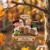 Closeup of Charlie Brown 60th Anniversary 1966-2026 Christmas Ornament hanging from a tree branch.