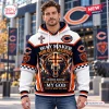Front view of a man wearing a Chicago Bears Way Maker Hoodie with bear and cross graphics.