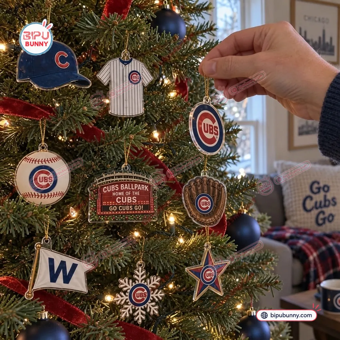 Hanging Chicago Cubs acrylic ornaments including the pinstripe jersey, royal blue C cap, leather mitt, and W flag on a Christmas tree
