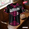 Front view of a black baseball jersey with pink geometric patterns and Los White Sox lettering.