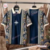 Front and back view of a blue and gold patterned Christian Dior Premium Polo Shirt with architectural and figure prints.