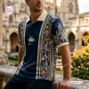 Front view of a Christian Dior Premium Polo Shirt featuring intricate blue and gold Renaissance architecture graphics.