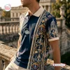 Side view of a man wearing a blue Christian Dior Premium Polo Shirt featuring intricate gold baroque patterns and historical graphics.