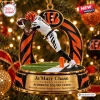 Closeup of a football player figurine on a base depicting an acrobatic catch for a Cincinnati Bengals Ja'Marr Chase Christmas Ornament.